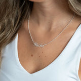 Personalized Name Necklace on Figaro Chain on a person