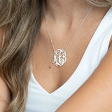 monogram necklace on a person